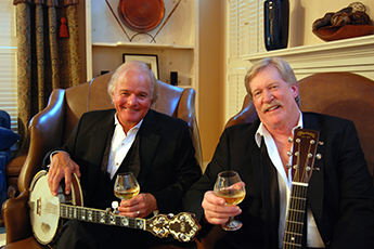 Banks & Shane Banks & Shane in Tuxes with banjo and wine glass